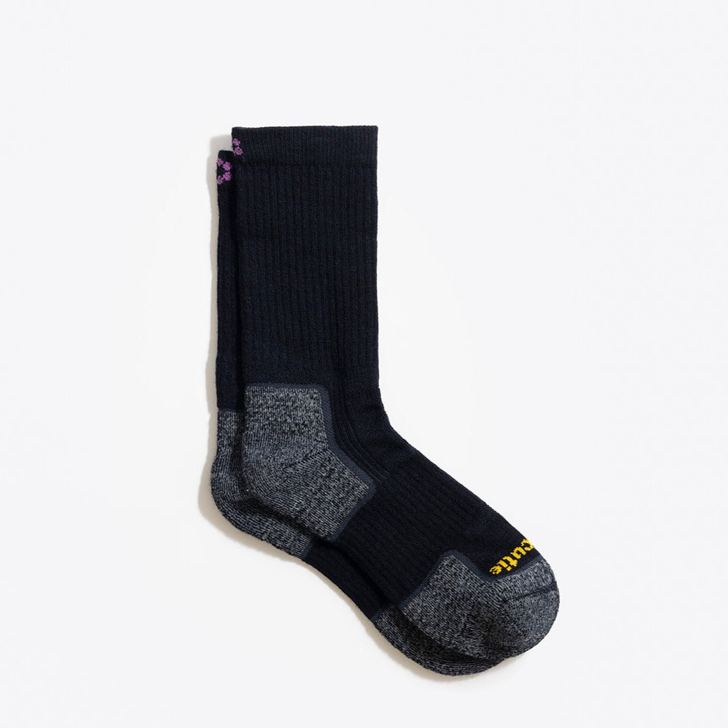 Women's black hiking sock with performance features shown