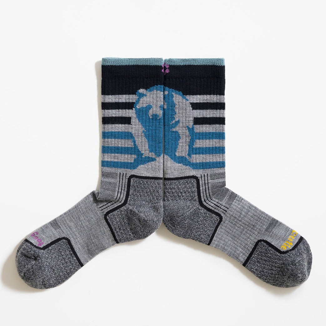 Multicolor (grey, blue haze, twilight blue and black) women's hiking sock featuring a black bear on the back and stripes with the ToughCutie logo on the toe - two socks pushed together