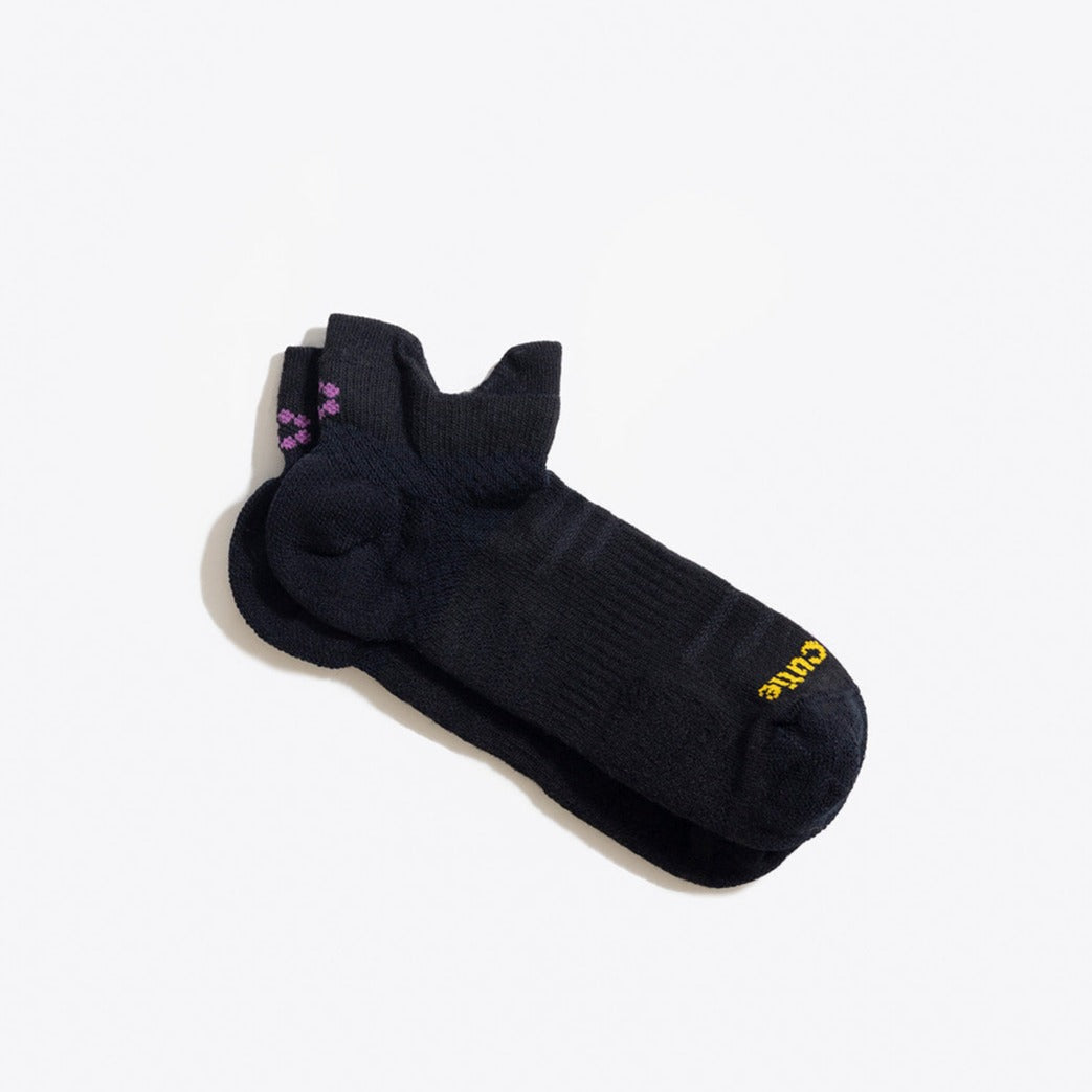 Black running sock laying flat with ToughCutie logo