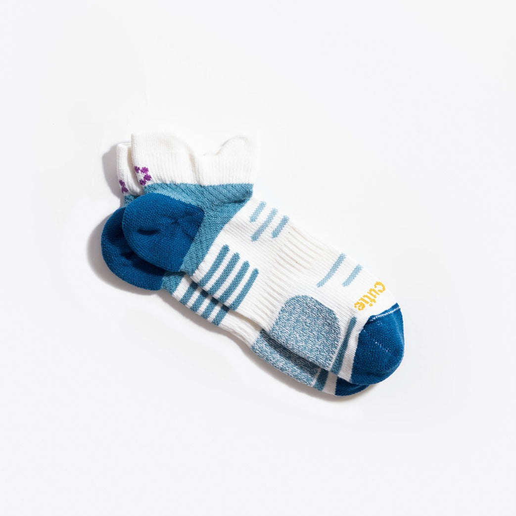 White, blue haze and twilight blue running sock laying flat with ToughCutie logo