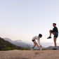 Two women stretching before a run